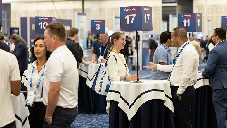 Networking event showcasing professionals engaging at tables, highlighting ORIL | custom software development company.